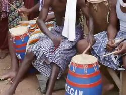 MS TU Man playing music an other dancing in Voodoo Ceremony / Togo Stock Footage