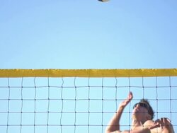 A man spiking a beach volleyball. - Slow Motion - filmed at 240 fps Stock Footage