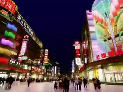 Time lapse long shot pedestrians walking past stores on Nanjing Road at night / Shanghai Stock Footage