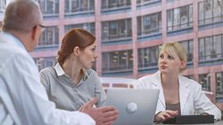 Doctor and head nurse in meeting with project manager Stock Footage