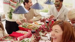 Friends and family enjoying Christmas dinner at table Stock Footage