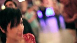 Friends dance to live music on Fremont Street in downtown Las Vegas Stock Footage