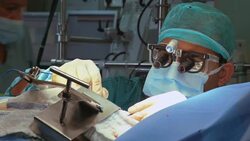 Focused surgeon operates a patient Stock Footage