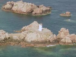 WS AERIAL ZI Shot of light house at Ile De Brehat / Brittany, Channel Isles Stock Footage