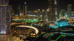 United Arab Emirates, Dubai, the Burj Khalifa, elevated view looking over the Dubai Mall - time lapse Stock Footage
