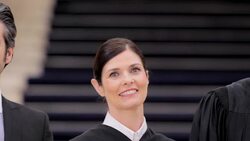 Judges and lawyers standing in courthouse Stock Footage