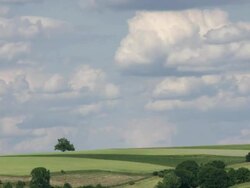 Clouds above farmland time lapse Stock Footage