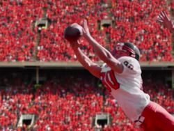 Slow motion, football player catches a football in a stadium Stock Footage