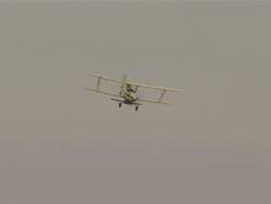 Shot of crop duster airplane flying by. Stock Footage