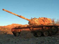 WS Broken down tank in the desert Stock Footage
