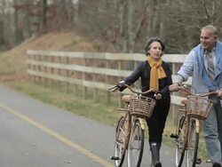 Mature couple walking with bicycles Stock Footage