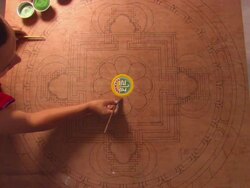 MS  monk touching  up border of  mandala sand painting before continuing with  process  / Kathmandu, Central, Nepal Stock Footage