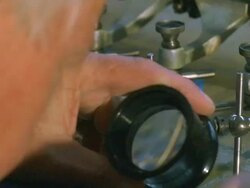 CU, Employee examining engraving plate for American one dollar bills, close-up of hands, Washington DC, USA Stock Footage