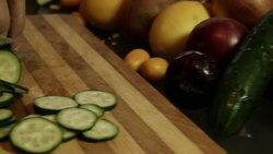 Closeup on housewife cutting cucumber Stock Footage