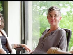 MS three businesswomen sitting in office having informal project meeting. Stock Footage