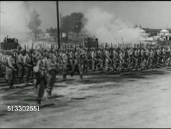 1942: FORT JACKSON REVIEW: Angled WS British Prime Minister Winston Churchill & officers standing outside barracks, WS Soldiers standing at attention w/ others firing salute BG, Churchill inspecting troops, British & Americans passing flag, saluting. Instructional Video