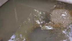 Flowing water at floodgate,Tilt Up Stock Footage