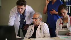 Professor and assistant doctor working on laptop Stock Footage