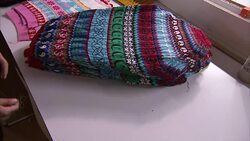 Christmas jumpers factory production line News Clip