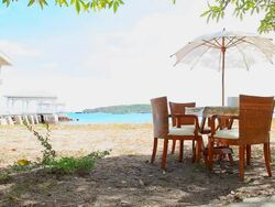 Table and chair under umbrella. Stock Footage