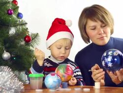 family paints Christmas toys Stock Footage