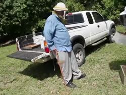 Mid tracking shot of Steve moving apiary to the Stock Footage