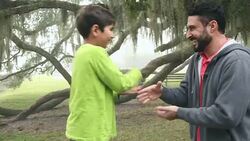 Hispanic father and son playing rock paper scissors Stock Footage