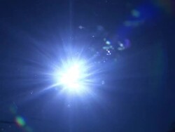 Sun through surface of sea, diver looks into camera, Guadalupe, Mexico, South America Stock Footage