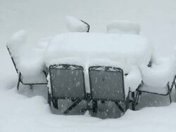 MS Heavy snow layer on furniture of garden at heavy snowfall / Saarburg, Rhineland-Palatinate, Germany Stock Footage