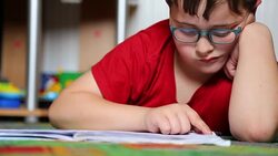 Little boy reading Stock Footage