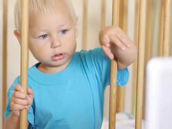 curious toddler looking at the monitor Stock Footage
