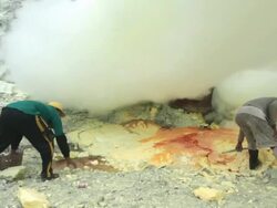 MS Miners at the Ijen volcano crater between the toxic clouds / Ijen, Java, Indonesia Stock Footage