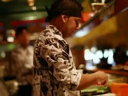 MS Shot of Japanese restaurant in Sao Paulo, Sushi prepared inside VW bus / Sao Paulo, Brazil  Stock Footage