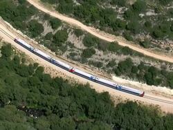 Aerial train moving through countryside, Judea, Israel Stock Footage