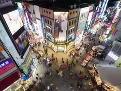 WS T/L Shot of people crowd moving in myungdong shopping district crossroads / Seoul, South Korea Stock Footage