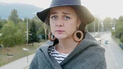 Young woman standing on a bridge contemplating having problems and looking at camera Stock Footage
