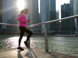 WS Young woman jogging in place in the city. Stock Footage