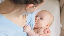Sick mother breastfeeding her baby Stock Footage