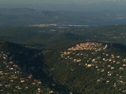 AERIAL Clusters of buildings on green hilltops/ La Croix Valmer, France Stock Footage