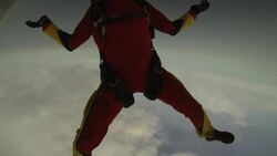 POV skydiving holding hands under a cloudy sky doing tricks with a smiling woman Stock Footage