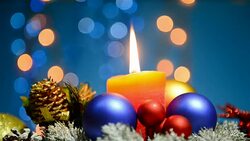 Christmas holiday decoration with candle, baubles and flashing lights Stock Footage