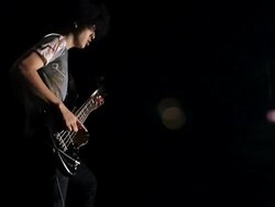 MS Shot of Young man playing bass guitar / Shinjuku, Tokyo, Japan Stock Footage