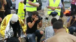 Syrian migrants fleeing the war and escaping to Europe, landing on the Greek island of Lesvos on the north coast at Efthalou. Up to 4,000 migrants a day are landing on the island and overwhelming the authorities. They are traficked by illegal Turkish peopl Stock Footage