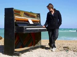 young woman playing the piano Stock Footage