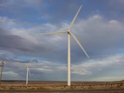 HD video wind turbines spin along Colorado highway Stock Footage