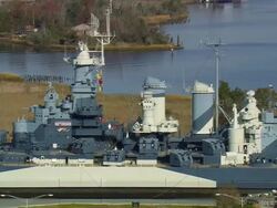 MS AERIAL Shot of USS North Carolina Battleship Museum / North Carolina, United States Stock Footage