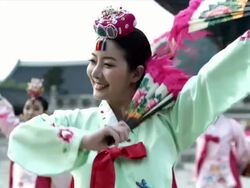 MS Group of Korean fan dance group performing behind Gyeongbokgung Palace / Seoul, South Korea  Stock Footage