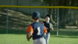 Medium slow motion panning shot of baseball outfielder catching ball / American Fork, Utah, United States Stock Footage