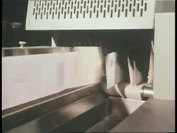 A machine sorts mail in a post office. News Clip