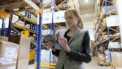 Responsible manager with tablet in warehouse Stock Footage